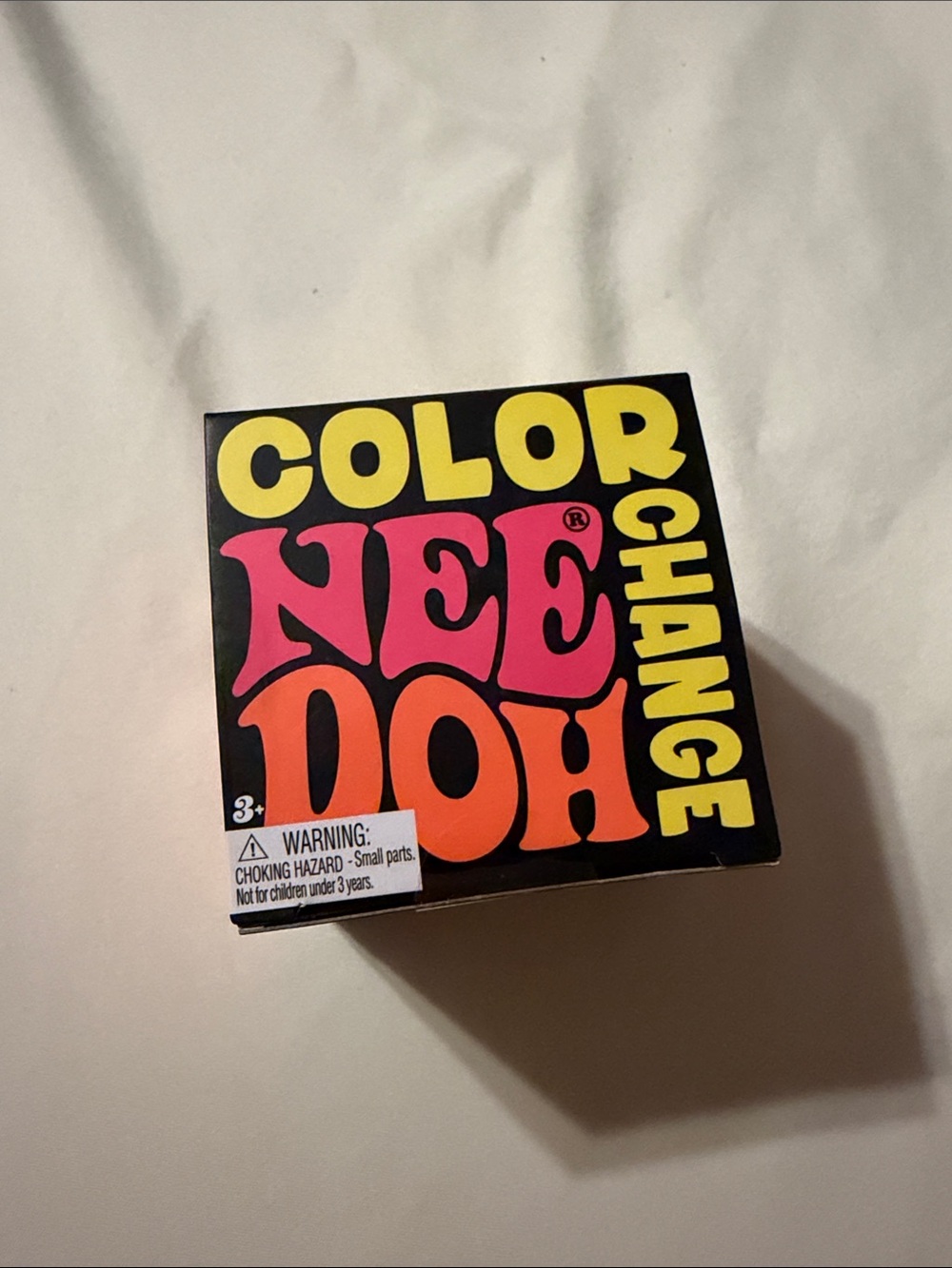 Color NeeDoh Change Sensory Toy - Black with Pink & Orange Accents